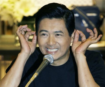 Chow Yun Fat touches his ears