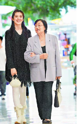 Joey Wang, circa 2005, on the streets of Vancouver with an elderly lady