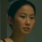 Karen Tong in Running on Karma (2003)